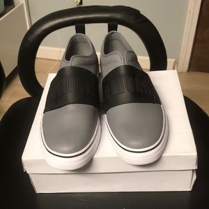 Pair of puma low cut casual